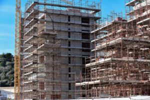 Active construction site with scaffolding and tools, showcasing the work of Franchise Construction.
